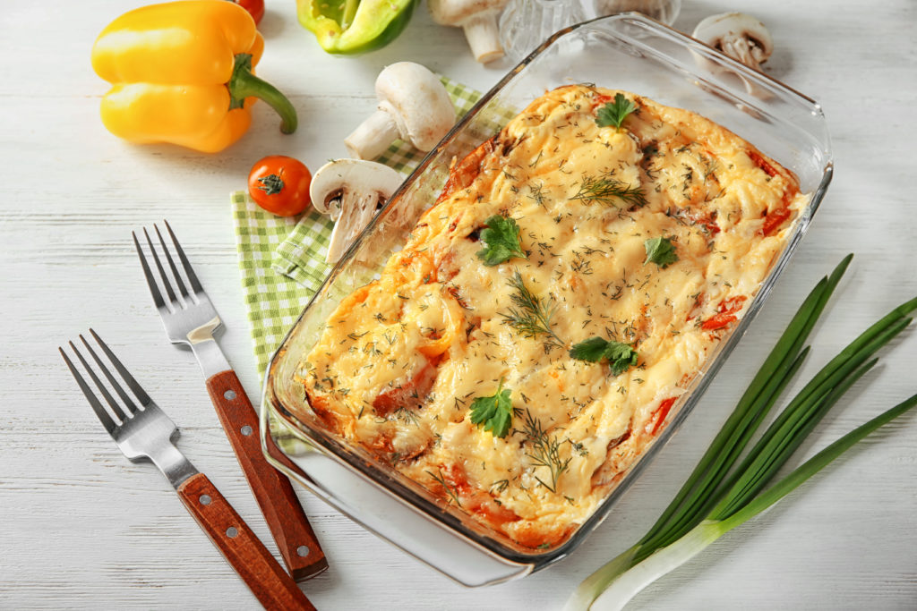 Glass baking dish with a delicious casserole fresh out of the oven and ready to eat.