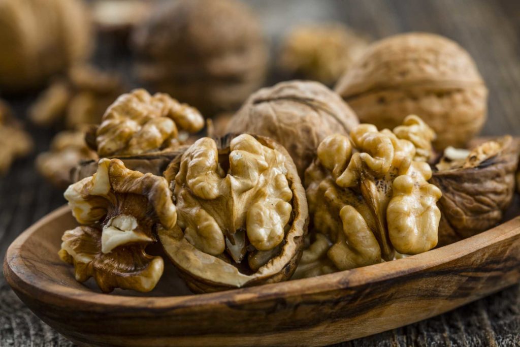 Whole and halved walnuts