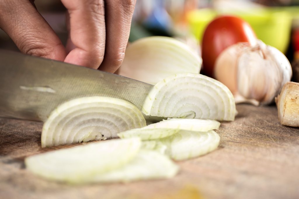 Onion sliced on cutting board