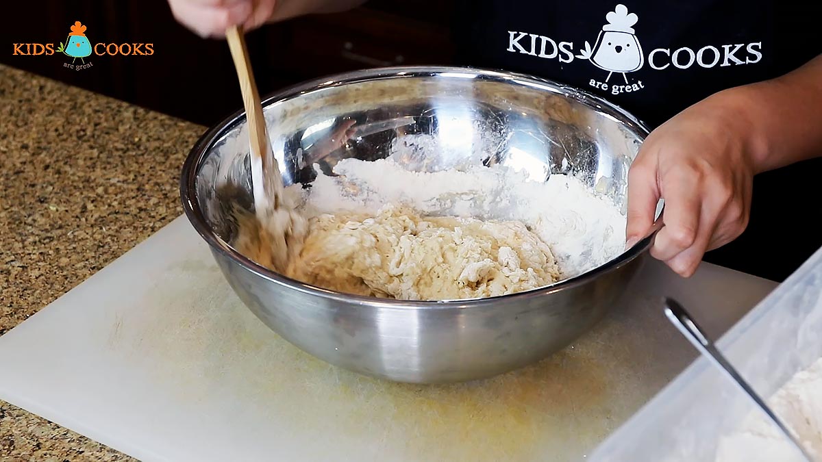 Add in one cup of flour at a time until the dough forms
