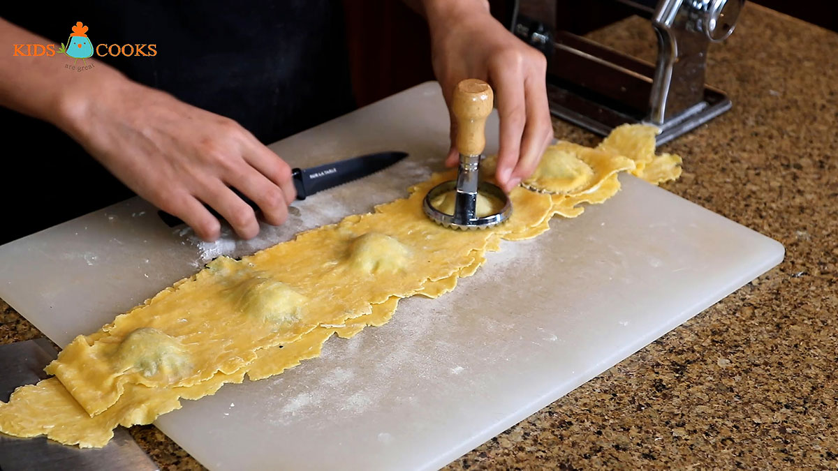 Fill the ravioli, close them, and cut them out with a ravioli cutter