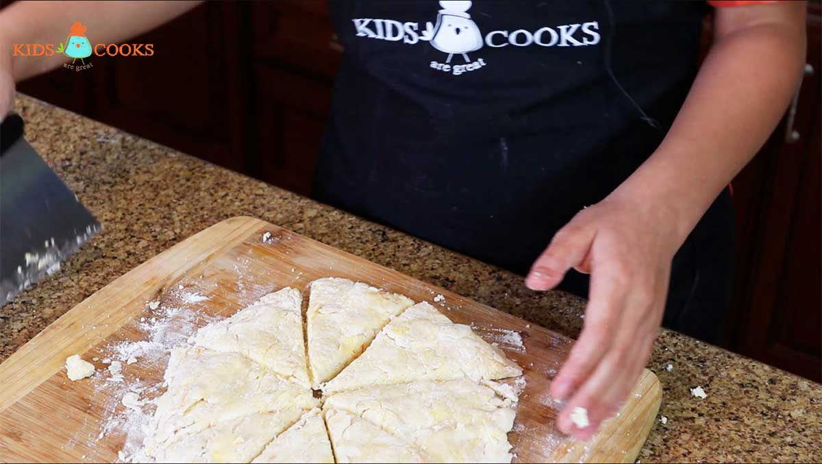 Place-the-dough-on-a-floured-surface-and-shape-into-a-disk.-Cut-into-scones