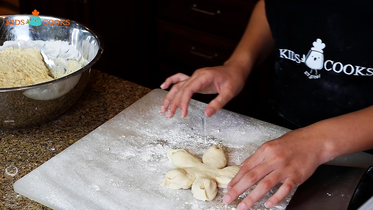 Shape your dough into flowers, buns, or other shapes and place on a baking sheet dusted with flour