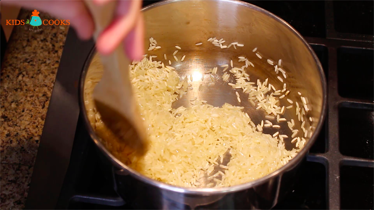 Add rice and stir until white