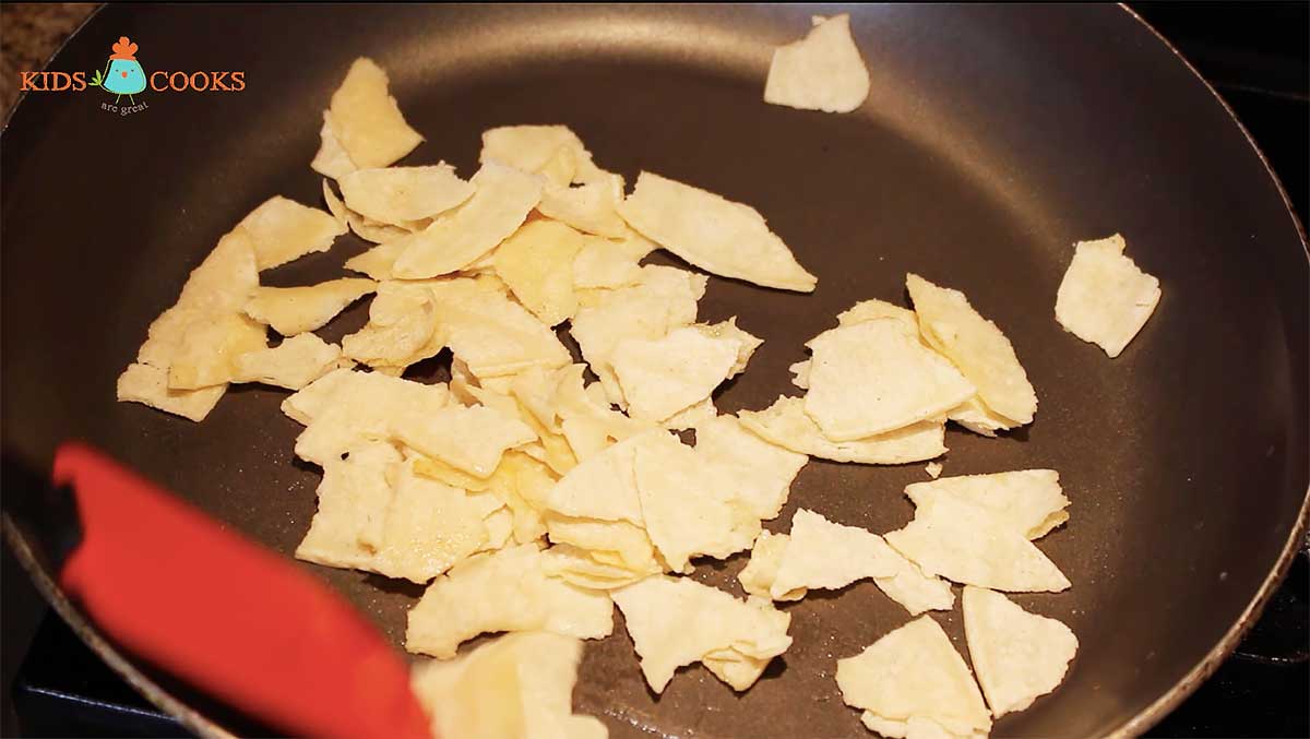 Cook shredded tortilla for two minutes