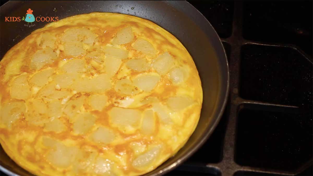 Once the eggs start to firm up, use a plate to flip the omelette and cook on the other side